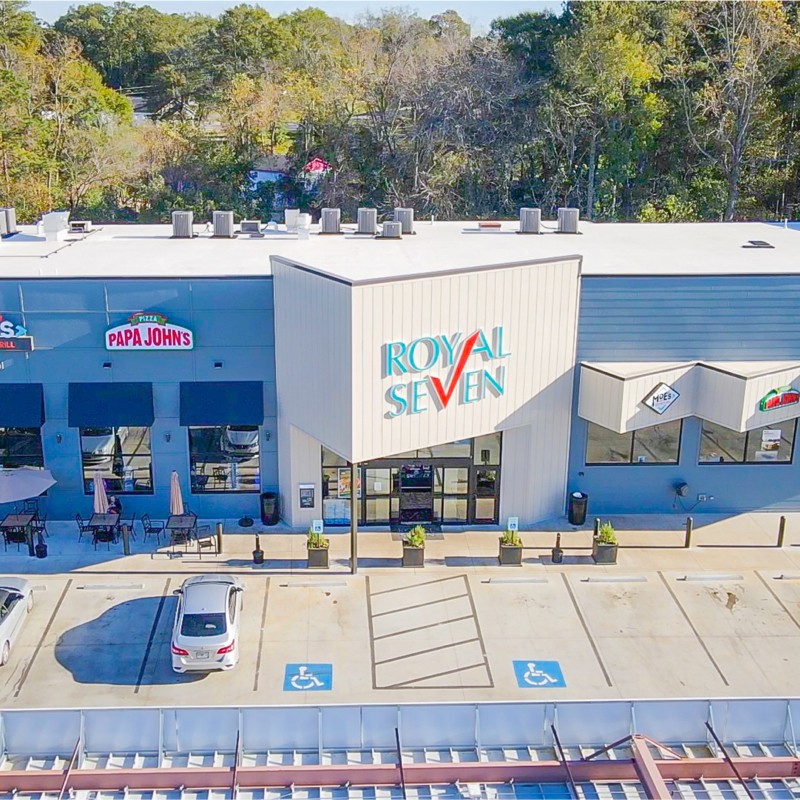 Royal Seven storefront with Papa John's and Moe's Southwest Grill